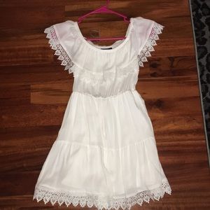 a white cute simple dress off the shoulder